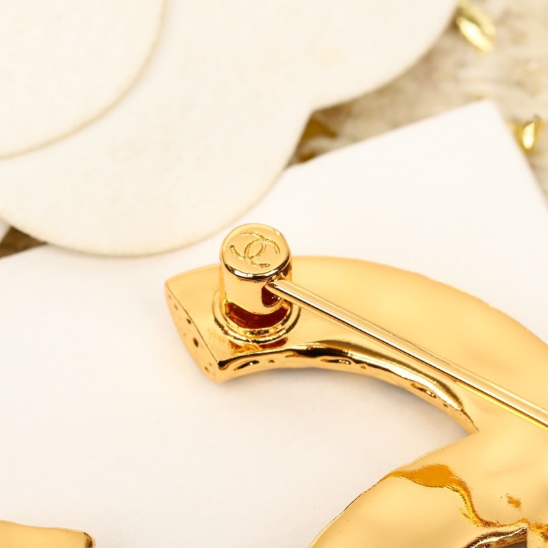 Ch**el brooches